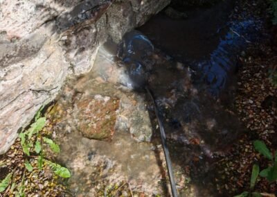 Drain clearance equipment being used at a main drain in Cardross