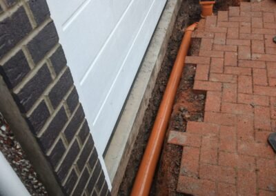 Buried drain excavation work in Drumchapel Glasgow by Unity Drainage Solutions