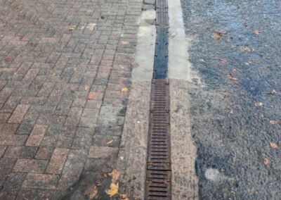 Surface drainage channel after cleaning at a commercial premises in Glasgow