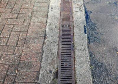 Close view of the drainage channel following maintenance at a Maryhill commercial site