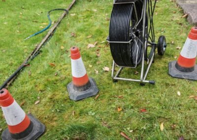Drain access cover in a grassed area at a Pollokshields property