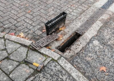 Removed drainage channel covers beside the exposed channel during cleaning work