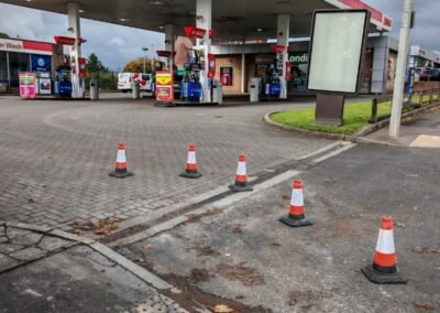 Esso fuel station forecourt in Maryhill, Glasgow, showing the drainage maintenance work area