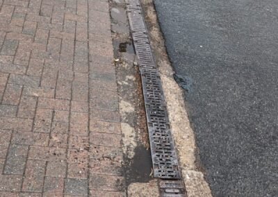 Surface drainage channel at a commercial fuel station in Maryhill, Glasgow, before cleaning