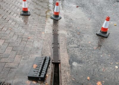 Water being flushed through a surface drainage channel during maintenance