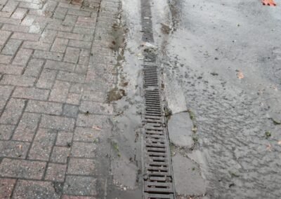 Water flowing around a surface drainage channel during the cleaning process
